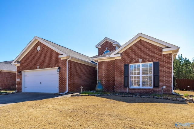 view of front of property featuring concrete driveway, an attached garage, and brick siding