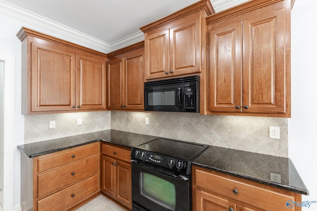 kitchen featuring backsplash, dark stone countertops, black appliances, and brown cabinets