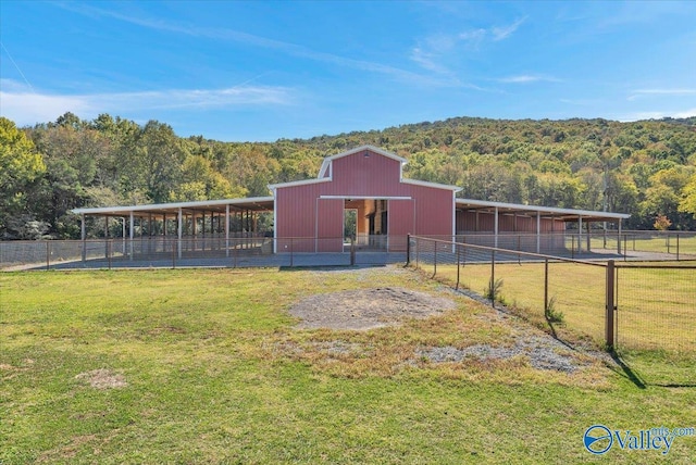 view of outbuilding featuring a yard