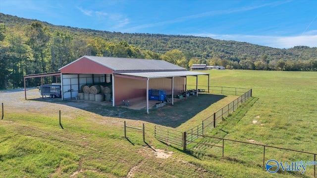 view of outbuilding with a rural view