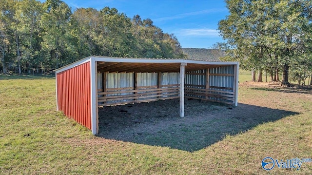 view of outdoor structure with a yard