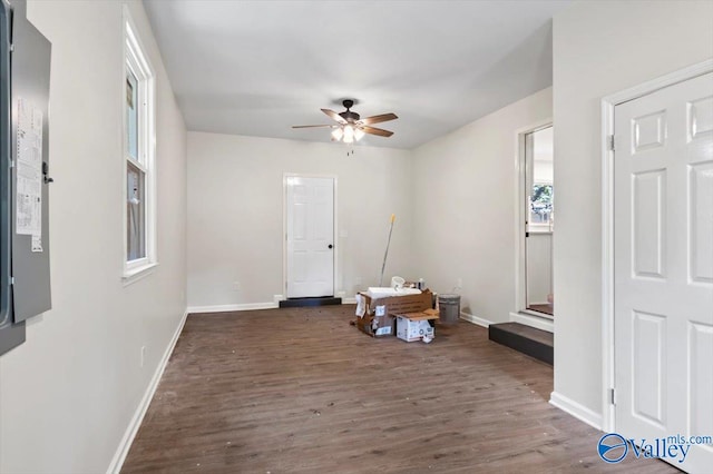 spare room with ceiling fan and dark hardwood / wood-style flooring