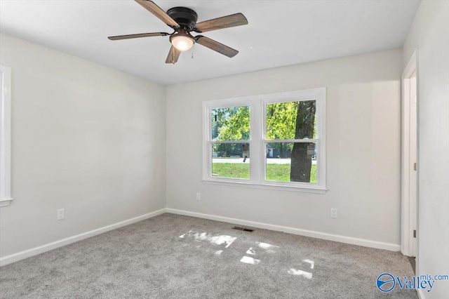 carpeted empty room with ceiling fan