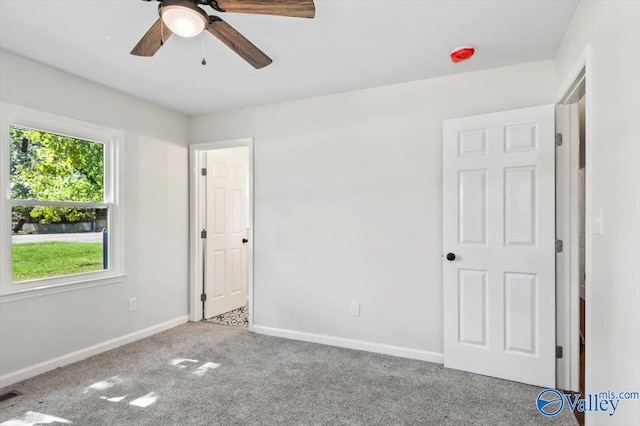 unfurnished bedroom featuring ceiling fan and light carpet