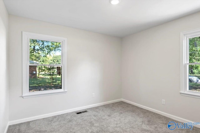 unfurnished room with carpet