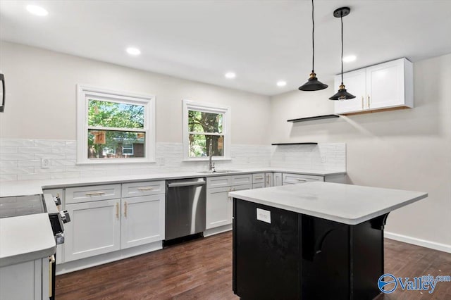 kitchen with stainless steel dishwasher, a center island, dark hardwood / wood-style floors, white cabinetry, and hanging light fixtures