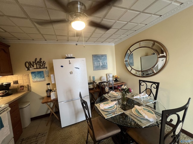 dining area featuring ornamental molding