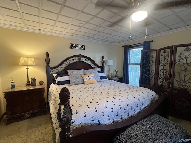 carpeted bedroom featuring crown molding