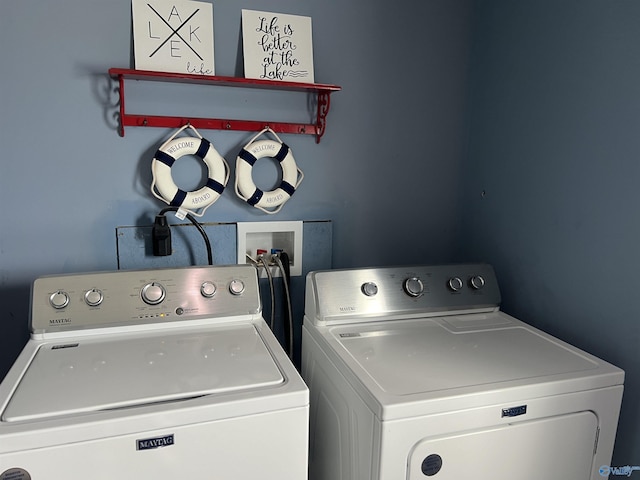 laundry room featuring washing machine and clothes dryer