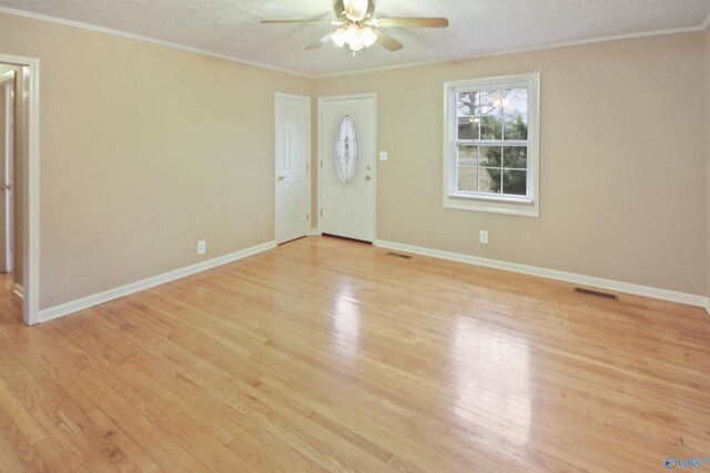 bedroom with a textured ceiling, hardwood / wood-style flooring, ceiling fan, and ornamental molding