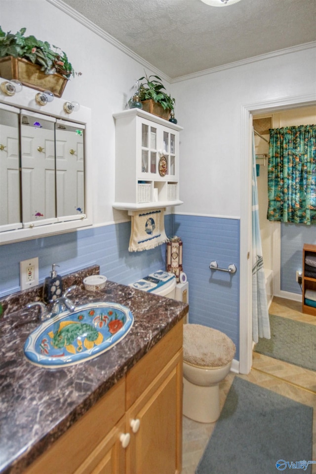 full bathroom with crown molding, vanity, a textured ceiling, and toilet