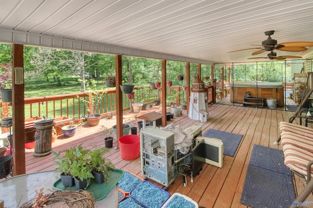 wooden deck featuring ceiling fan, an outdoor living space, and a hot tub