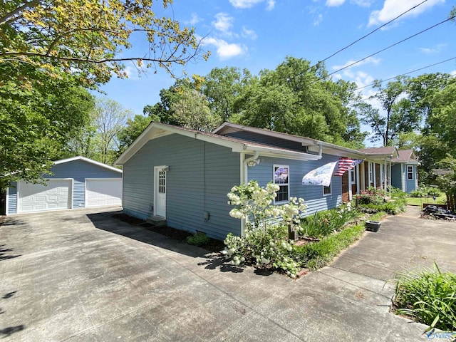 view of side of home with an outbuilding and a garage