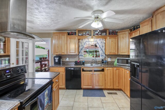 kitchen featuring tasteful backsplash, a textured ceiling, sink, black appliances, and light tile patterned flooring