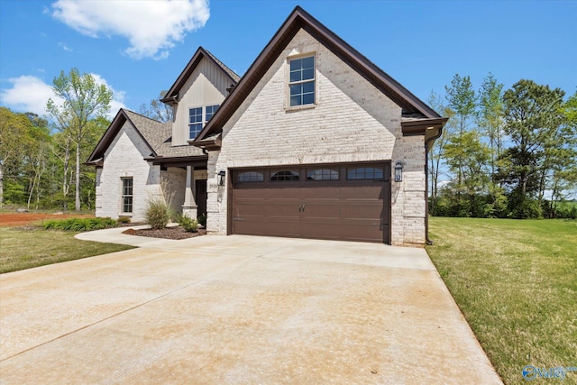 view of front of home with a garage and a front yard