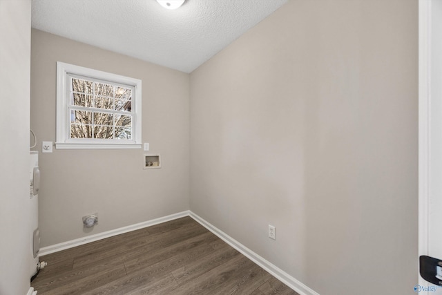 washroom with dark wood-type flooring, washer hookup, a textured ceiling, and hookup for an electric dryer