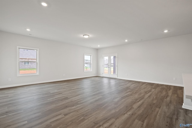 unfurnished room featuring french doors and hardwood / wood-style flooring