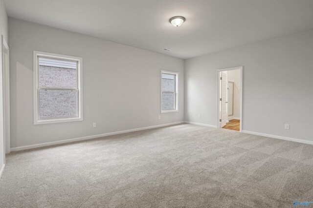 unfurnished room with wood-type flooring