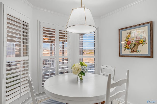 dining area featuring crown molding