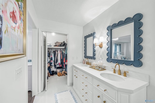 bathroom featuring vanity and a textured ceiling