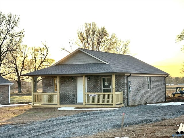 bungalow-style home featuring a front lawn