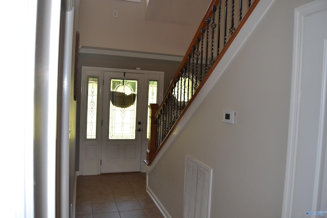 foyer with light tile patterned flooring