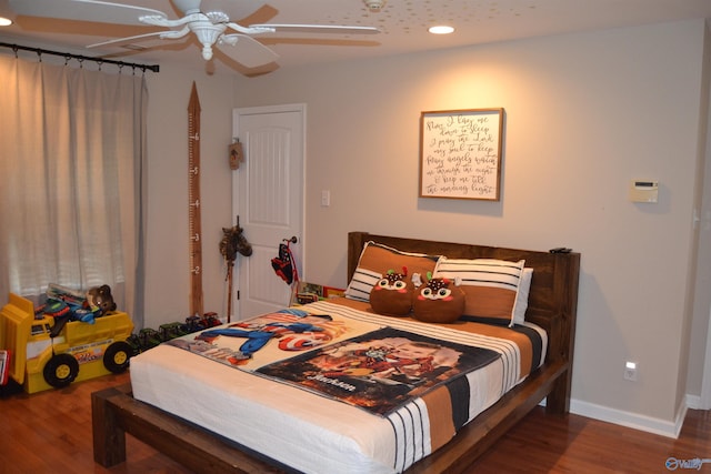 bedroom featuring ceiling fan and hardwood / wood-style flooring