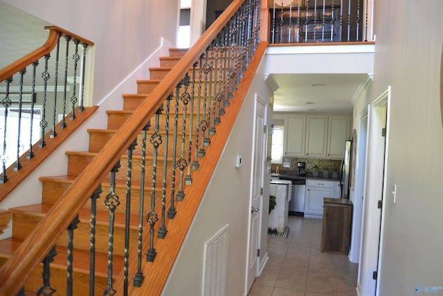 stairway featuring tile patterned floors