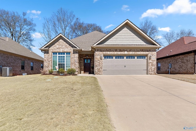 view of front facade featuring a garage, concrete driveway, roof with shingles, cooling unit, and brick siding