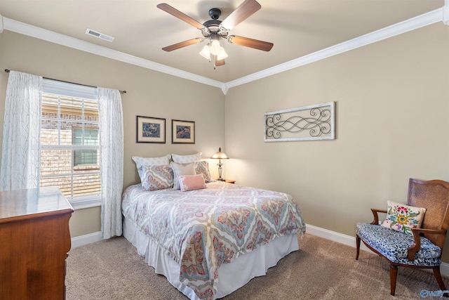 bedroom featuring baseboards, carpet, visible vents, and crown molding