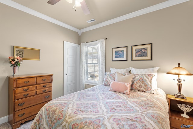 bedroom with ornamental molding, visible vents, and a ceiling fan