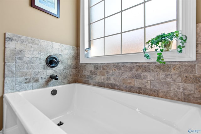 bathroom with a garden tub