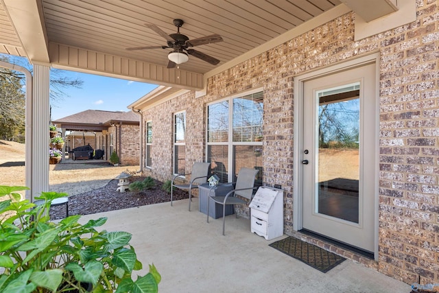 view of patio / terrace featuring ceiling fan