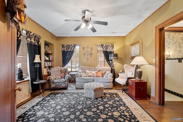 living room featuring ceiling fan and hardwood / wood-style floors