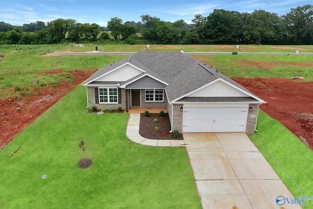 216 Roman Randall Rd, New Market, AL 35761 - view of front of house with an attached garage, driveway, a front yard, and brick siding