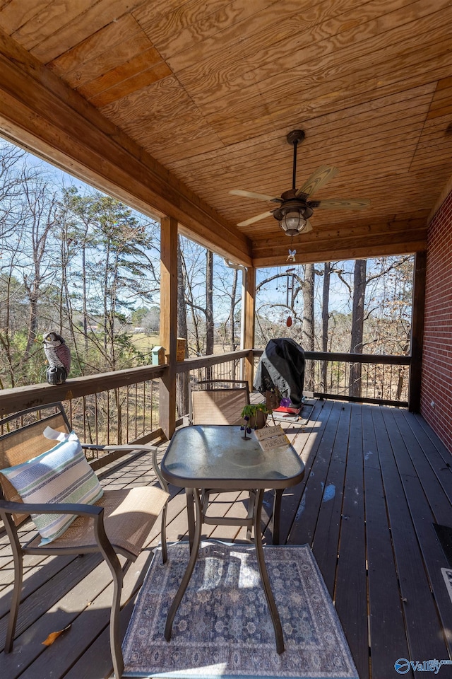 deck with ceiling fan and area for grilling