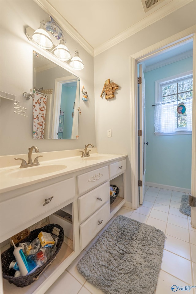 full bathroom with double vanity, crown molding, a sink, and tile patterned floors