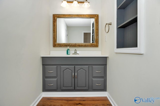 bathroom featuring vanity and hardwood / wood-style floors