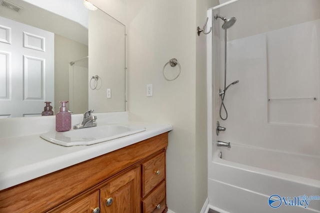 bathroom with vanity and washtub / shower combination