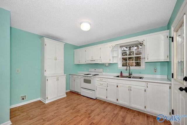 kitchen with sink, white electric stove, and white cabinets