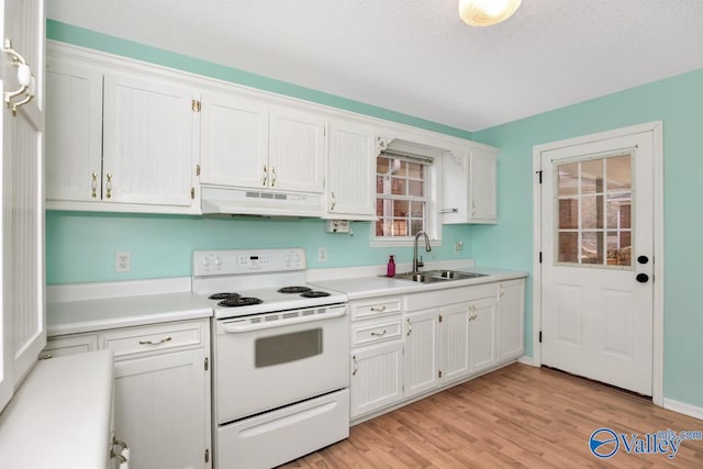 kitchen with white range with electric cooktop, light hardwood / wood-style floors, sink, and white cabinets