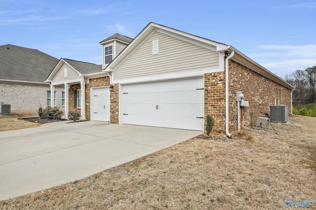 view of front facade featuring driveway, central AC unit, an attached garage, and brick siding