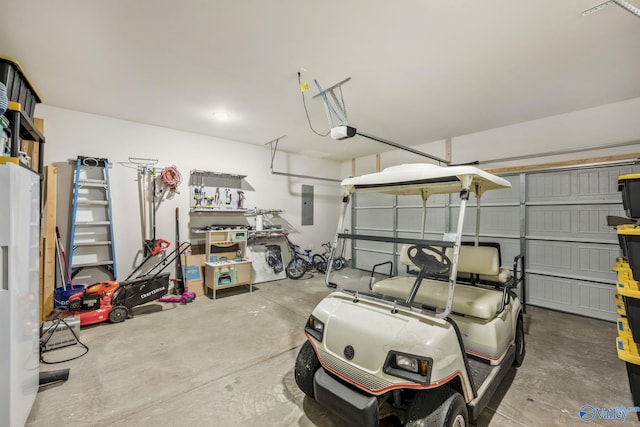 garage featuring electric panel and a garage door opener