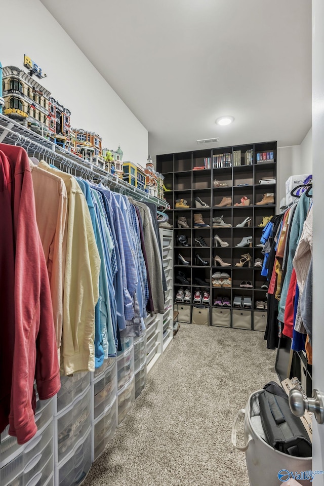 walk in closet with carpet floors and visible vents