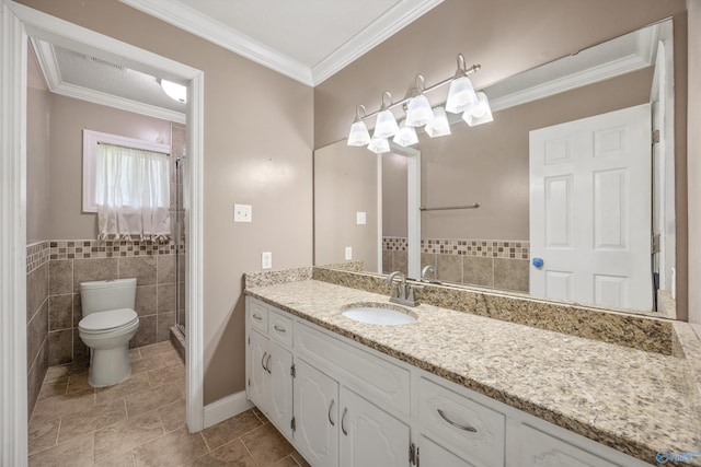 16712 Brooks Dr, Athens, AL 35611 - full bath featuring toilet, vanity, tile walls, tile patterned floors, and crown molding