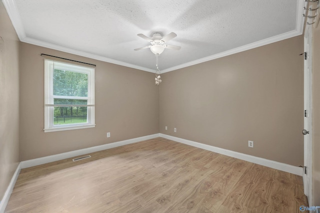 16712 Brooks Dr, Athens, AL 35611 - spare room with a ceiling fan, light wood-type flooring, baseboards, a textured ceiling, and ornamental molding
