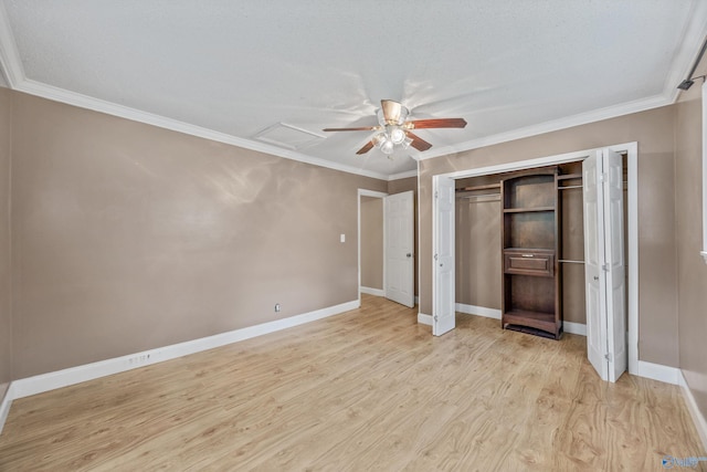 16712 Brooks Dr, Athens, AL 35611 - unfurnished bedroom featuring light wood-style flooring, crown molding, baseboards, a ceiling fan, and a closet