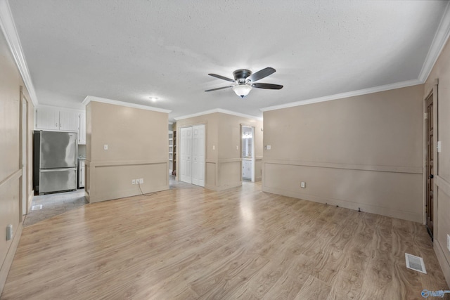 16712 Brooks Dr, Athens, AL 35611 - unfurnished living room with light wood finished floors, ceiling fan, a textured ceiling, and ornamental molding