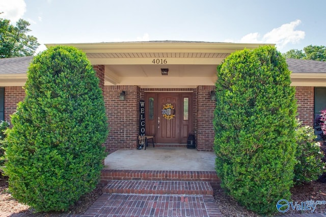 entrance to property with brick siding