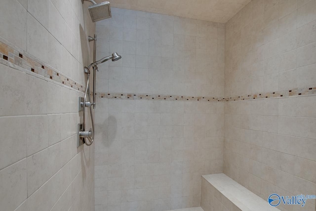 full bathroom featuring tiled shower